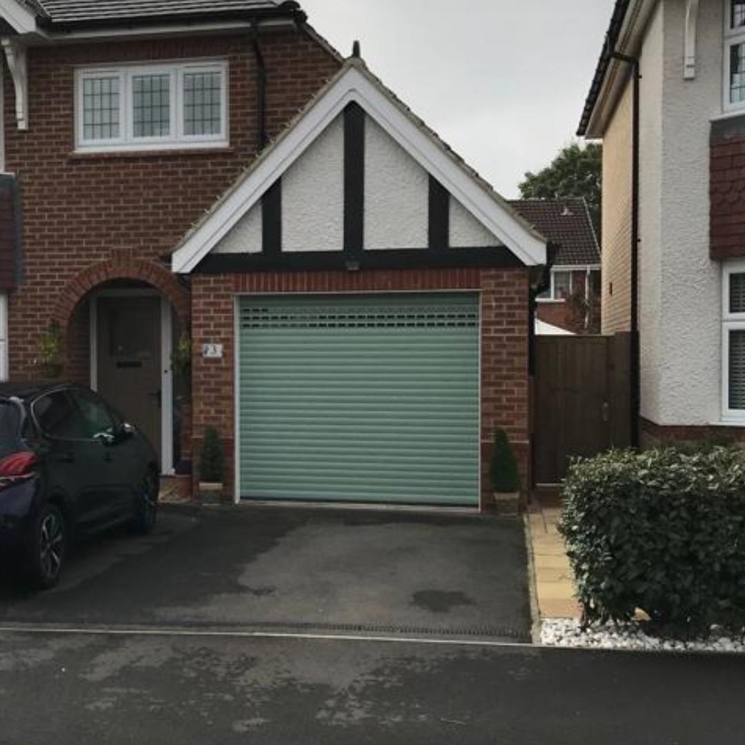 green garage door installed in bedford